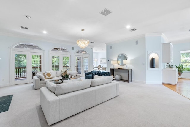6008 Woodview Ave, Austin, TX 78757 - living room featuring ornamental molding, light carpet, a chandelier, and recessed lighting