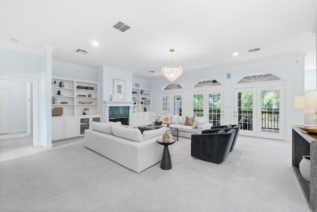 6008 Woodview Ave, Austin, TX 78757 - living area featuring ornamental molding, light colored carpet, recessed lighting, a premium fireplace, and a chandelier