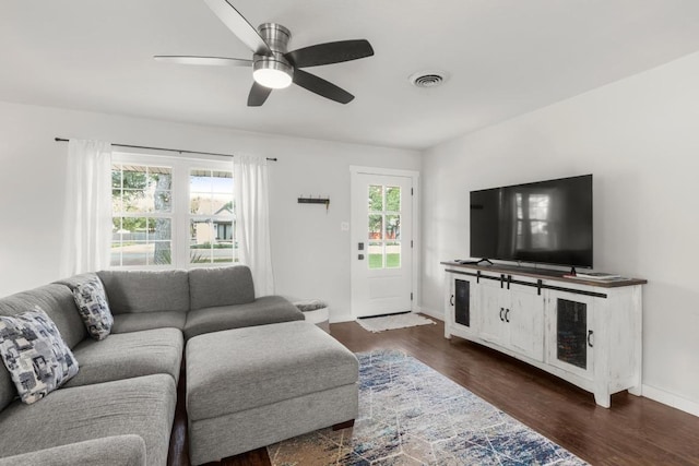 219 S Bluff St, Dripping Springs, TX 78620 - living area featuring a ceiling fan, dark wood-type flooring, and baseboards