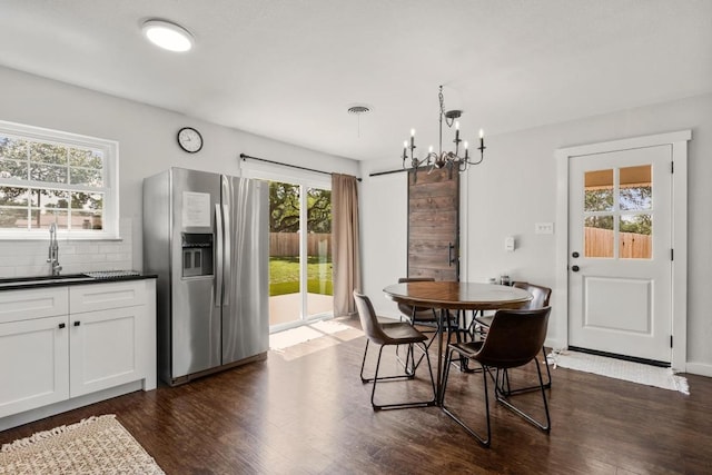 219 S Bluff St, Dripping Springs, TX 78620 - dining area featuring plenty of natural light and dark wood-type flooring