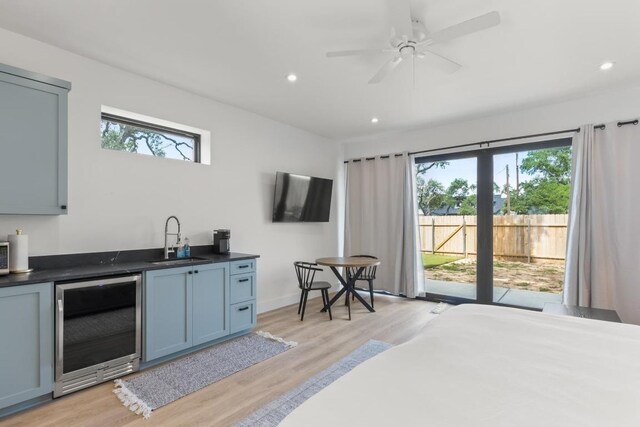 219 S Bluff St, Dripping Springs, TX 78620 - indoor wet bar featuring wine cooler, light wood-style flooring, recessed lighting, ceiling fan, and baseboards
