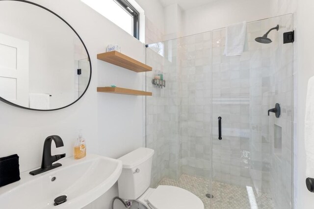 219 S Bluff St, Dripping Springs, TX 78620 - full bath featuring a sink, toilet, and a shower stall