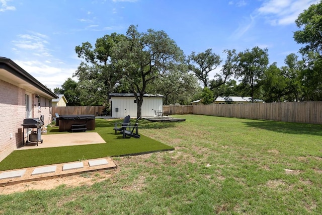 219 S Bluff St, Dripping Springs, TX 78620 - view of yard featuring a hot tub and a patio