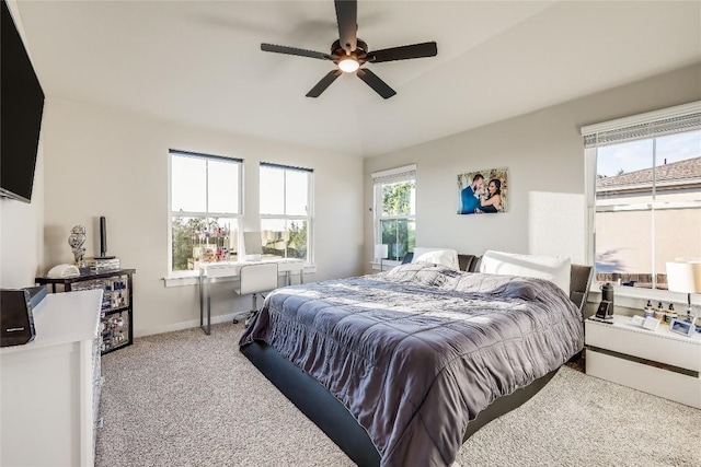 3204 Mount Vernon Ave, Lago Vista, TX 78645 - bedroom featuring light carpet, an office area, ceiling fan, and baseboards