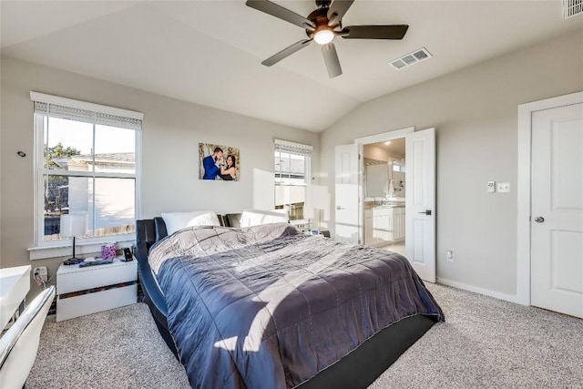 3204 Mount Vernon Ave, Lago Vista, TX 78645 - bedroom featuring lofted ceiling, light colored carpet, ensuite bathroom, ceiling fan, and baseboards