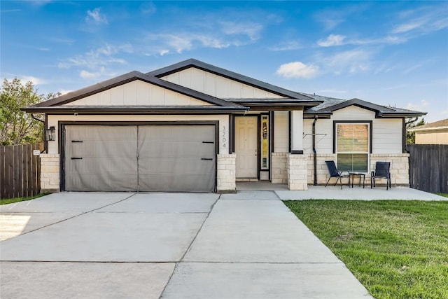 3204 Mount Vernon Ave, Lago Vista, TX 78645 - ranch-style home with a garage, driveway, board and batten siding, and stone siding