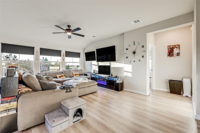 3204 Mount Vernon Ave, Lago Vista, TX 78645 - living room featuring a ceiling fan, healthy amount of natural light, light wood-style flooring, and vaulted ceiling