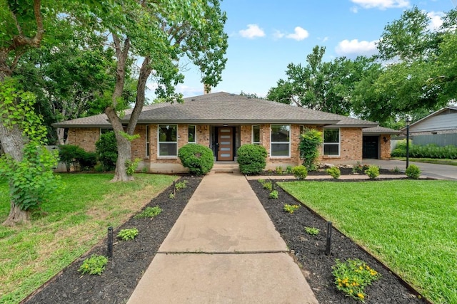 801 Lime Rock Dr, Round Rock, TX 78681 - single story home featuring a front lawn, brick siding, a garage, a shingled roof, and concrete driveway