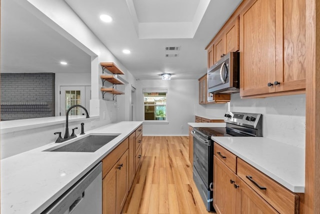801 Lime Rock Dr, Round Rock, TX 78681 - kitchen with appliances with stainless steel finishes, light wood-style floors, light countertops, open shelves, and recessed lighting
