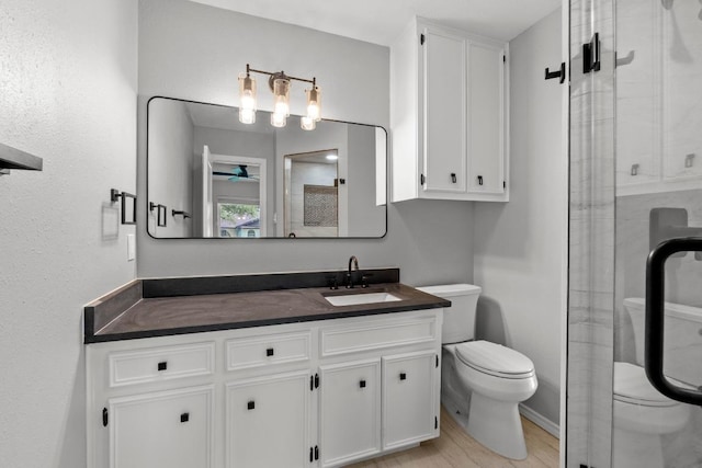 801 Lime Rock Dr, Round Rock, TX 78681 - bathroom featuring vanity, a shower stall, and wood finished floors