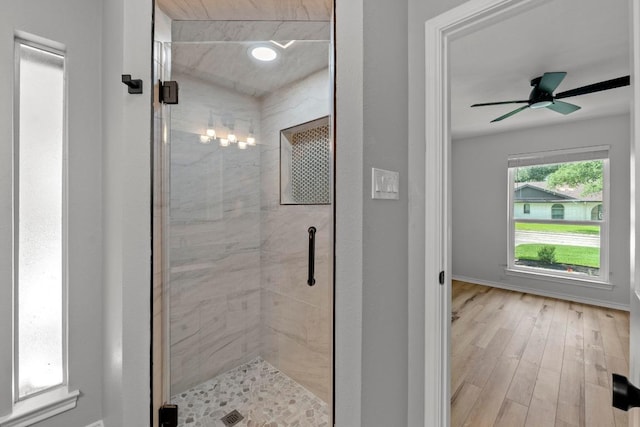 801 Lime Rock Dr, Round Rock, TX 78681 - full bathroom featuring a shower stall, a ceiling fan, and wood finished floors