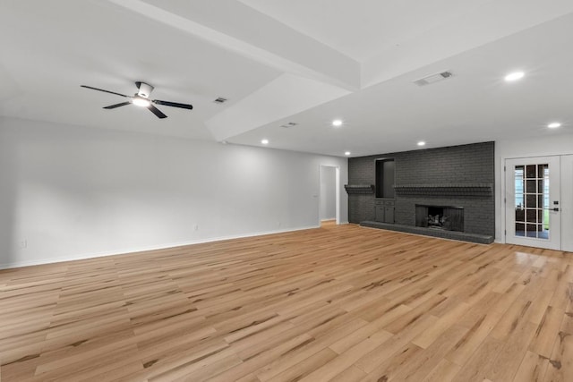 801 Lime Rock Dr, Round Rock, TX 78681 - unfurnished living room featuring light wood-style flooring, a brick fireplace, ceiling fan, and recessed lighting