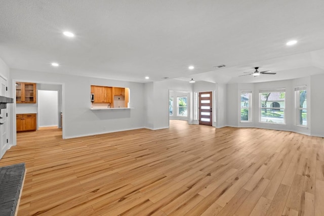 801 Lime Rock Dr, Round Rock, TX 78681 - unfurnished living room with recessed lighting, light wood-style flooring, and ceiling fan