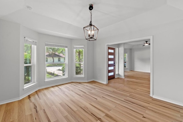 801 Lime Rock Dr, Round Rock, TX 78681 - empty room featuring light wood-style flooring, a chandelier, and a smoke detector