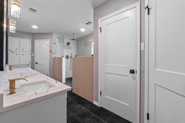 801 Lime Rock Dr, Round Rock, TX 78681 - full bathroom with tile patterned flooring, a walk in shower, double vanity, and recessed lighting