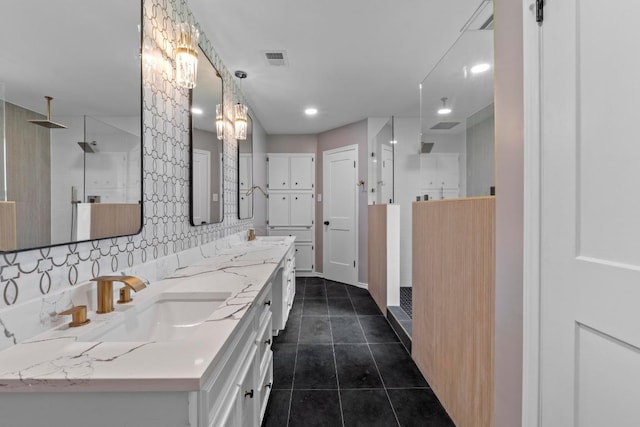 801 Lime Rock Dr, Round Rock, TX 78681 - bathroom with a walk in shower, double vanity, tile patterned floors, decorative backsplash, and recessed lighting