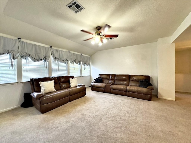 404 Autumn Trl, Georgetown, TX 78626 - carpeted living room featuring a ceiling fan, baseboards, a textured ceiling, and vaulted ceiling