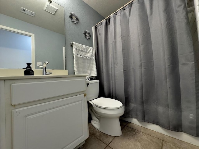 404 Autumn Trl, Georgetown, TX 78626 - bathroom with toilet, vanity, tile patterned floors, curtained shower, and a textured wall