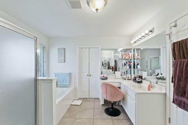 404 Autumn Trl, Georgetown, TX 78626 - full bathroom with a bath, tile patterned flooring, a stall shower, and vanity