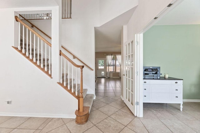 404 Autumn Trl, Georgetown, TX 78626 - foyer entrance featuring stairs, light tile patterned floors, and french doors