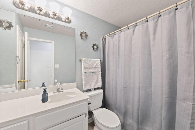 404 Autumn Trl, Georgetown, TX 78626 - bathroom with vanity, a textured wall, and a textured ceiling