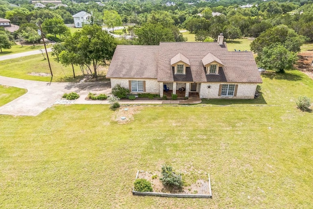 518 Clear Creek Ln, Dripping Springs, TX 78620 - view of front of house featuring a chimney, a front lawn, and a porch