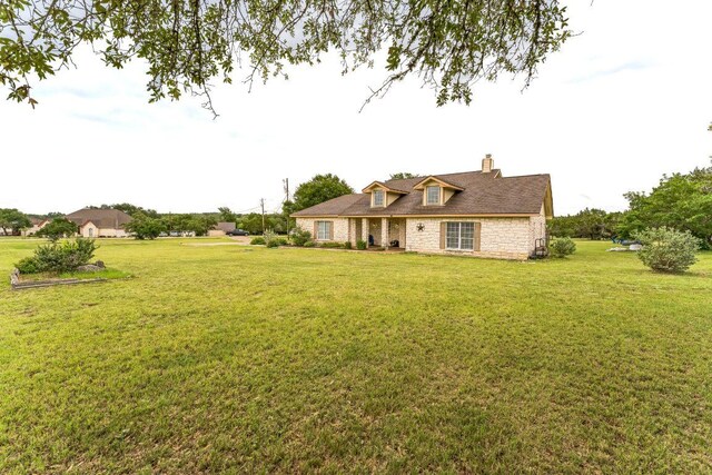 518 Clear Creek Ln, Dripping Springs, TX 78620 - view of front of property with a chimney and a front yard