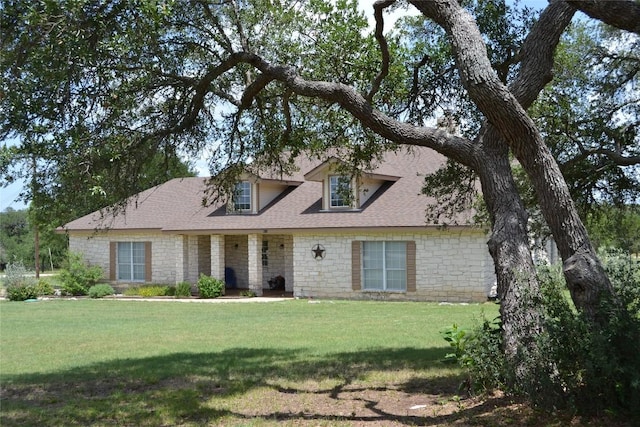 518 Clear Creek Ln, Dripping Springs, TX 78620 - cape cod home with roof with shingles, a front lawn, and stone siding