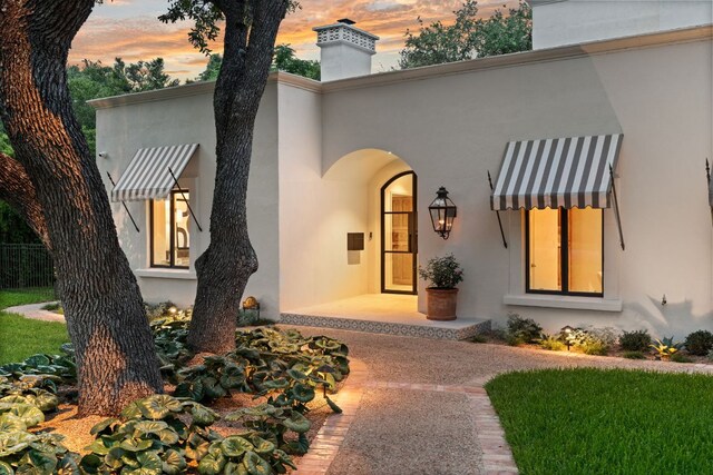 4622 Lake View Dr, Austin, TX 78731 - view of front of property featuring stucco siding and a chimney