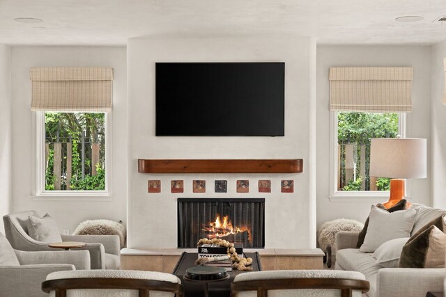 4622 Lake View Dr, Austin, TX 78731 - living area with a lit fireplace and plenty of natural light