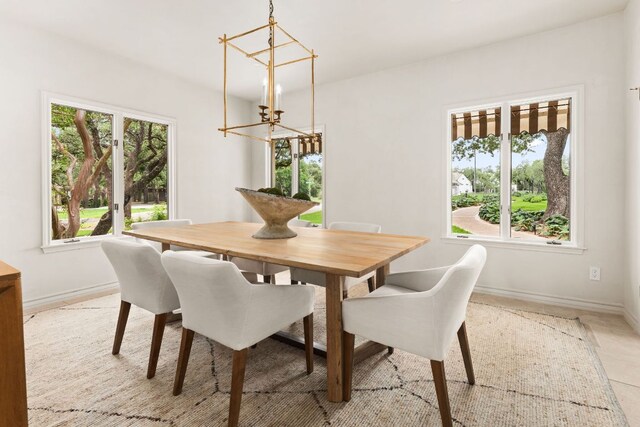4622 Lake View Dr, Austin, TX 78731 - dining area with a chandelier, healthy amount of natural light, and baseboards