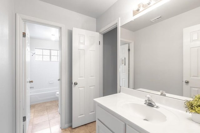 10701 Redmond Rd, Austin, TX 78739 - full bathroom featuring vanity, tile patterned floors, and shower / tub combination
