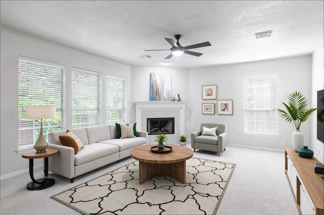 10701 Redmond Rd, Austin, TX 78739 - living area featuring a ceiling fan, carpet, and a glass covered fireplace