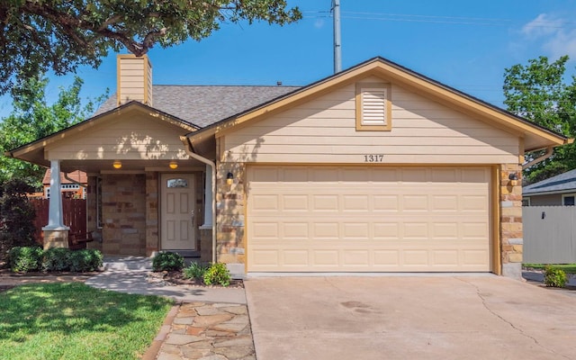 1317 Black Cherry Dr, Cedar Park, TX 78613 - view of front of home featuring stone siding, a chimney, concrete driveway, and an attached garage