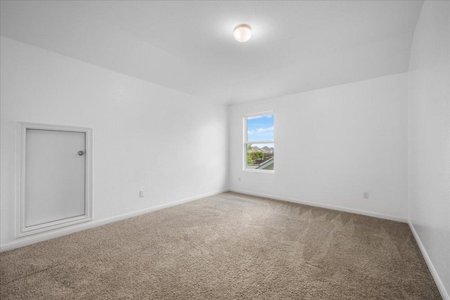 1013 S San Marcos St, Manor, TX 78653 - carpeted spare room featuring baseboards