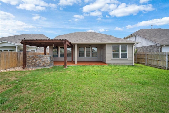1013 S San Marcos St, Manor, TX 78653 - back of property with ceiling fan and a fenced backyard