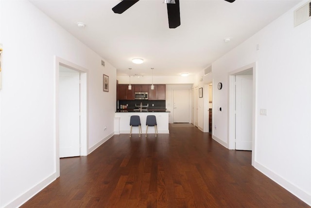 3016 Guadalupe St Unit 202, Austin, TX 78705 - unfurnished living room with ceiling fan, dark wood-style floors, a sink, and baseboards