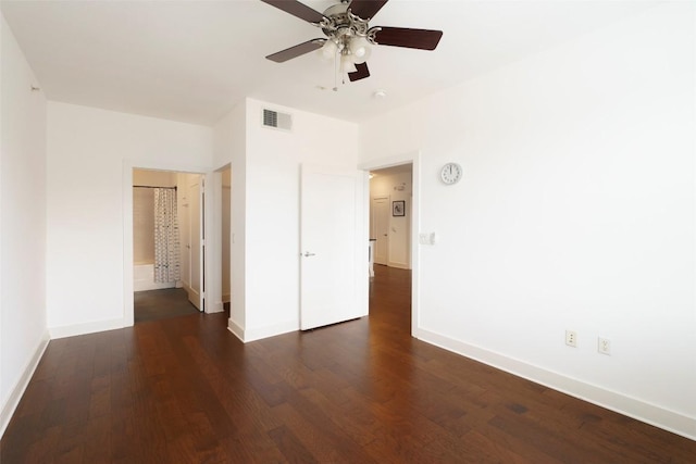 3016 Guadalupe St Unit 202, Austin, TX 78705 - unfurnished bedroom with dark wood-style flooring, baseboards, ceiling fan, and ensuite bath