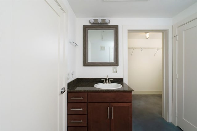 3016 Guadalupe St Unit 202, Austin, TX 78705 - bathroom featuring vanity and a walk in closet