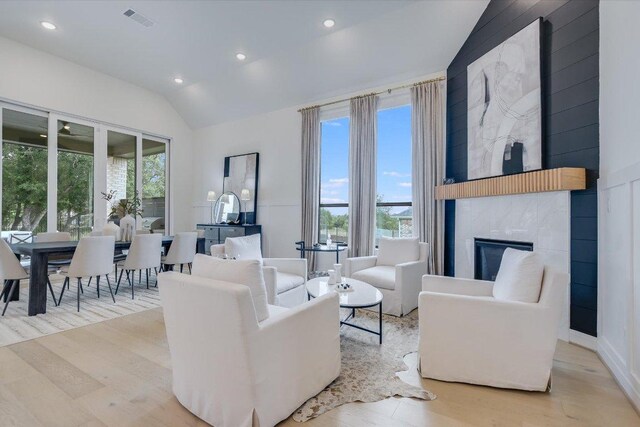 200 Bright Sky Dr, Austin, TX 78737 - living room featuring lofted ceiling, wood finished floors, recessed lighting, and a large fireplace