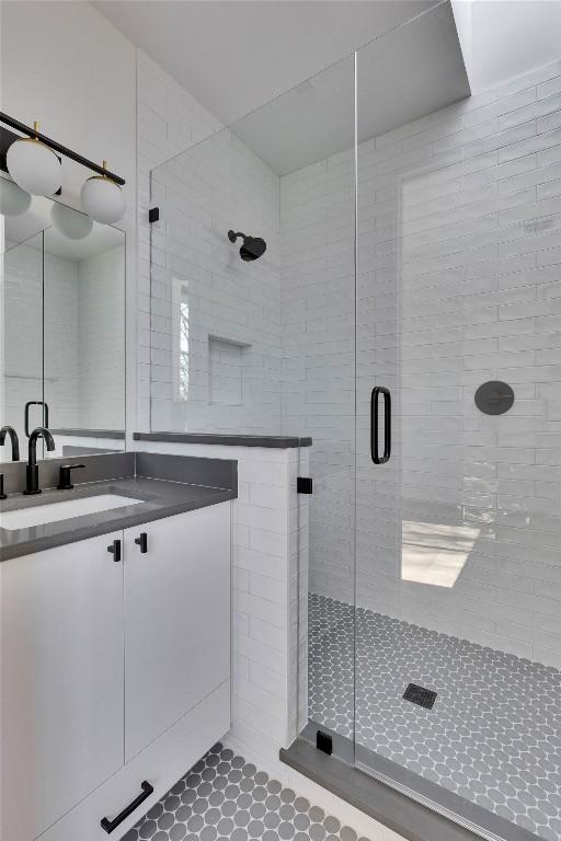 1804 Sylvan Dr Unit 2, Austin, TX 78741 - full bath with a stall shower, vanity, and tile patterned flooring