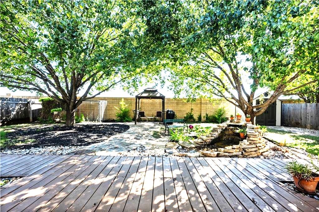 1900 Rutherford Dr, Leander, TX 78641 - wooden terrace featuring a fenced backyard