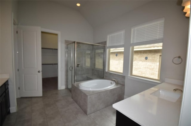 121 Bright Valley Way, Austin, TX 78737 - bathroom with vanity, a stall shower, lofted ceiling, a bath, and tile patterned floors