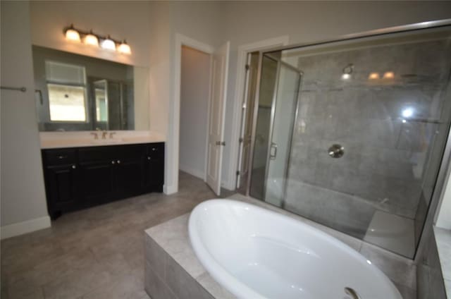 121 Bright Valley Way, Austin, TX 78737 - bathroom with vanity, a garden tub, a shower stall, and baseboards
