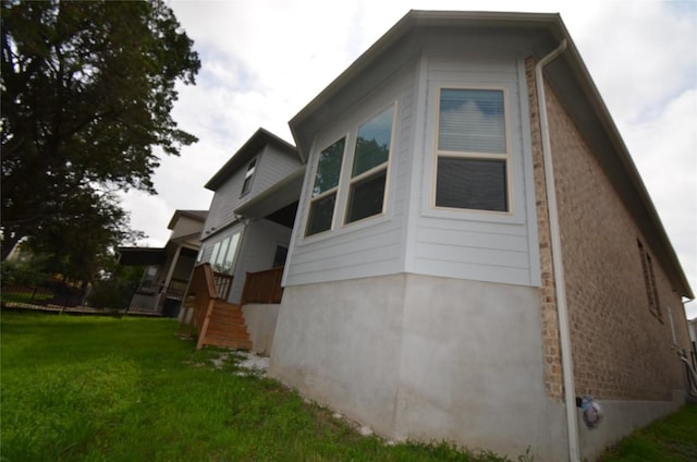121 Bright Valley Way, Austin, TX 78737 - view of side of home featuring a lawn
