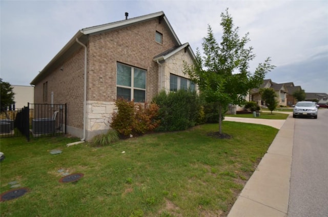 121 Bright Valley Way, Austin, TX 78737 - view of side of home featuring stone siding and brick siding