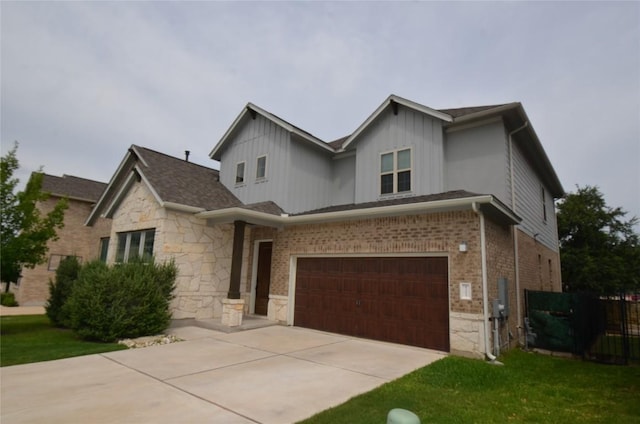 121 Bright Valley Way, Austin, TX 78737 - view of front of home featuring a garage, stone siding, concrete driveway, and board and batten siding