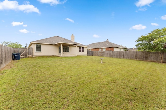 117 Kerley Dr, Hutto, TX 78634 - back of house featuring a chimney
