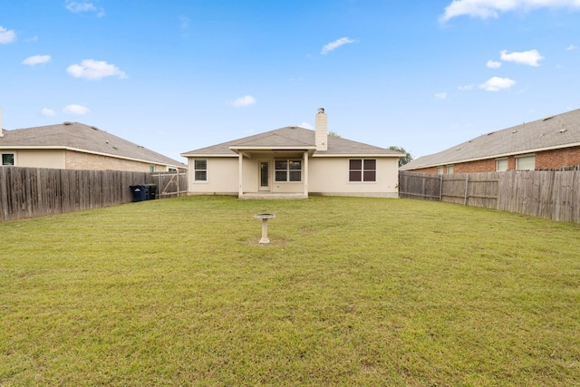 117 Kerley Dr, Hutto, TX 78634 - rear view of property featuring a chimney
