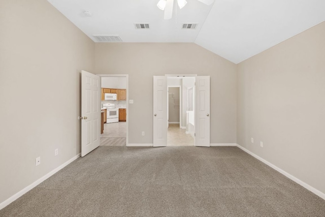 117 Kerley Dr, Hutto, TX 78634 - unfurnished bedroom with carpet floors, vaulted ceiling, and a ceiling fan